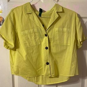 This is a light green collared shirt.